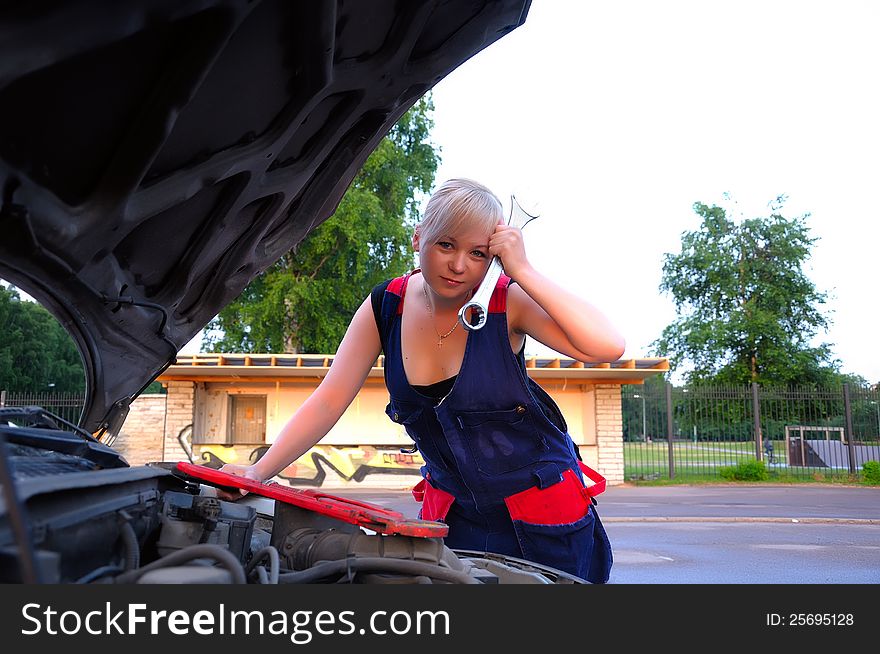 Beautiful  Woman Repairing The Car