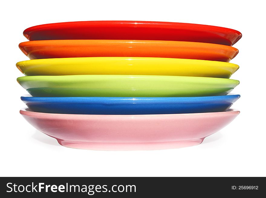 The composition photo of six saucers sorted by color of a rainbow and isolated on white background. The composition photo of six saucers sorted by color of a rainbow and isolated on white background.