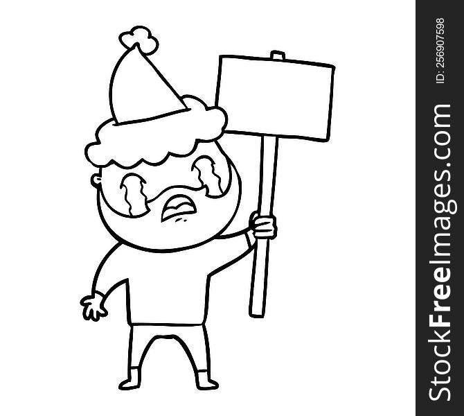 hand drawn line drawing of a bearded protester crying wearing santa hat