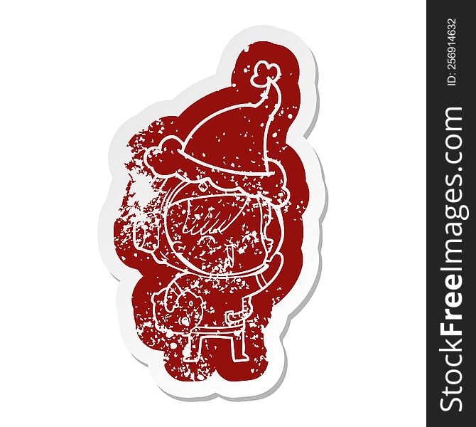 Cartoon Distressed Sticker Of A Happy Spacegirl Holding Moon Rock Wearing Santa Hat