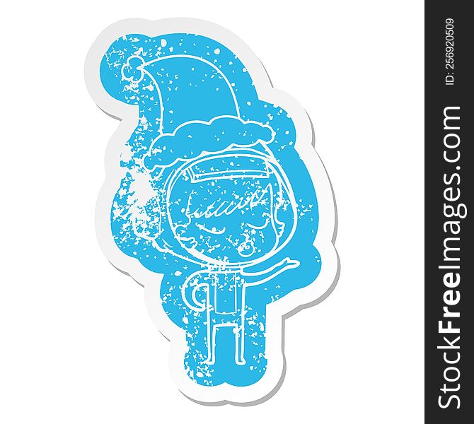 quirky cartoon distressed sticker of a pretty astronaut girl wearing santa hat