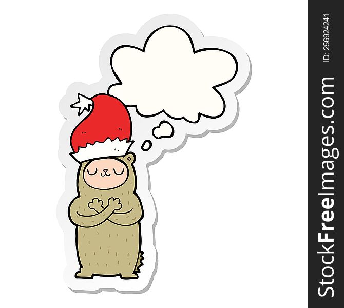 cartoon bear wearing christmas hat with thought bubble as a printed sticker