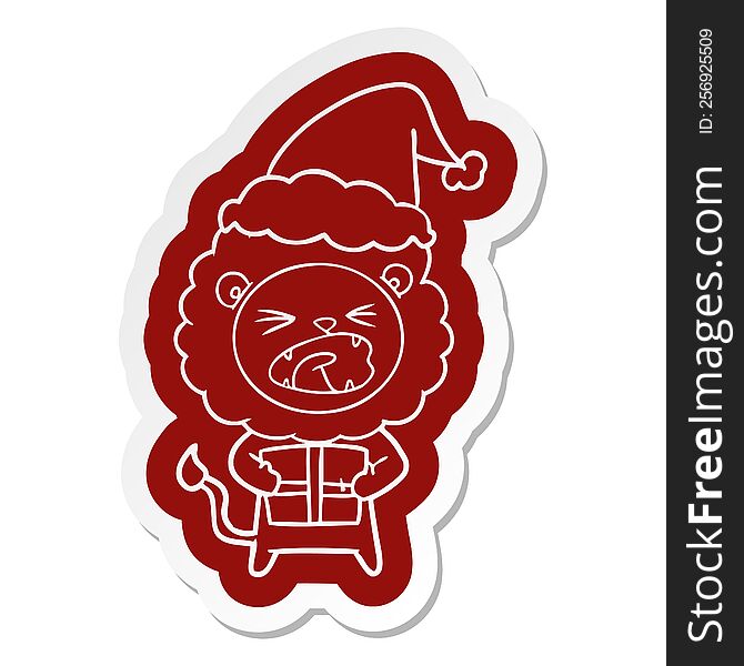 Cartoon  Sticker Of A Lion With Christmas Present Wearing Santa Hat