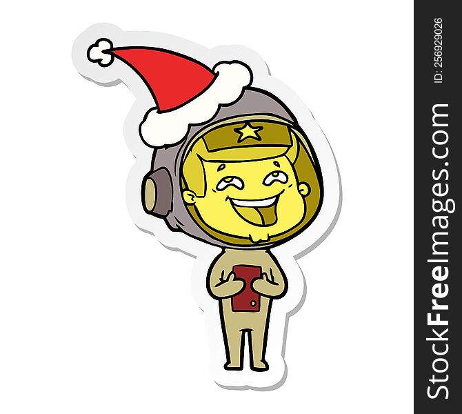 Sticker Cartoon Of A Laughing Astronaut Wearing Santa Hat