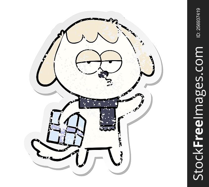 Distressed Sticker Of A Cartoon Bored Dog With Christmas Present