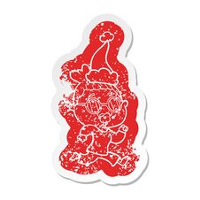 Cartoon Distressed Sticker Of A Woman Wearing Spectacles Wearing Santa Hat Stock Photography