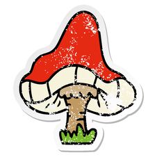 Distressed Sticker Cartoon Doodle Of A Single Mushroom Royalty Free Stock Photo
