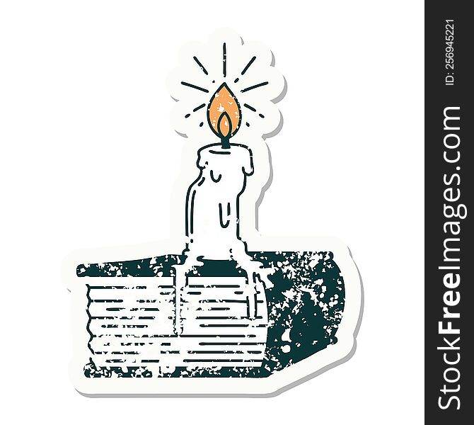 worn old sticker of a tattoo style candle melting on book. worn old sticker of a tattoo style candle melting on book