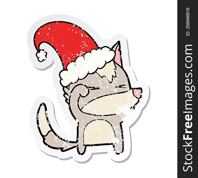 distressed sticker of a tired wolf cartoon wearing xmas hat