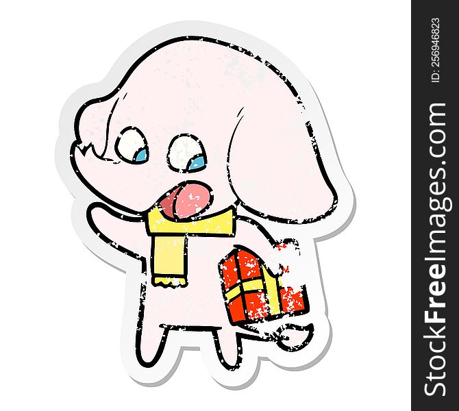 distressed sticker of a cute cartoon elephant with christmas present