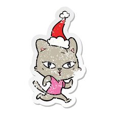 Distressed Sticker Cartoon Of A Cat Out For A Run Wearing Santa Hat Stock Image