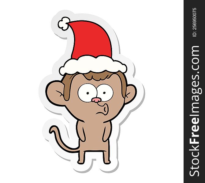 hand drawn sticker cartoon of a hooting monkey wearing santa hat