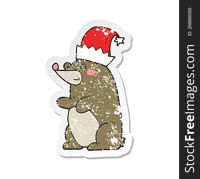 Retro Distressed Sticker Of A Cartoon Bear Wearing Christmas Hat