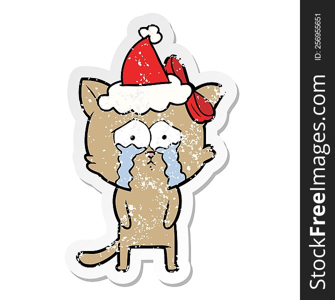 Distressed Sticker Cartoon Of A Cat Wearing Santa Hat
