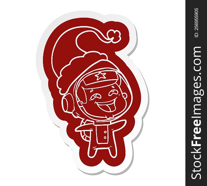 Cartoon  Sticker Of A Laughing Astronaut Wearing Santa Hat