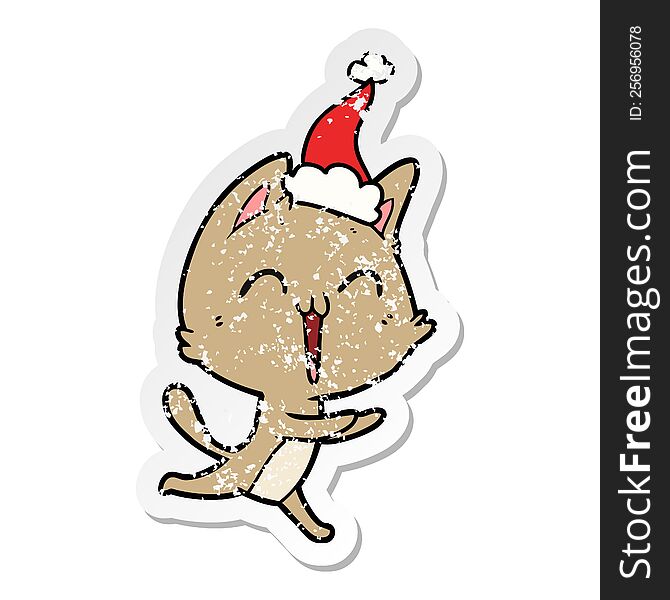 happy hand drawn distressed sticker cartoon of a cat meowing wearing santa hat