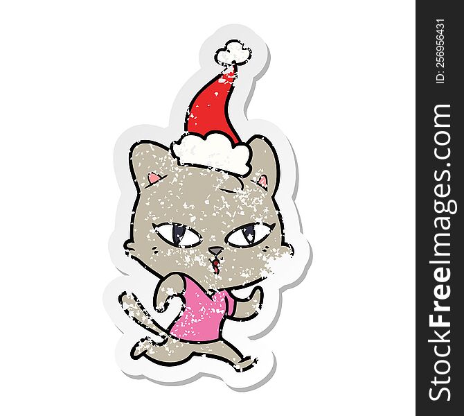distressed sticker cartoon of a cat out for a run wearing santa hat