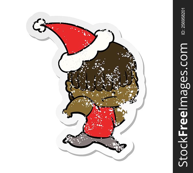 hand drawn distressed sticker cartoon of a boy with untidy hair wearing santa hat