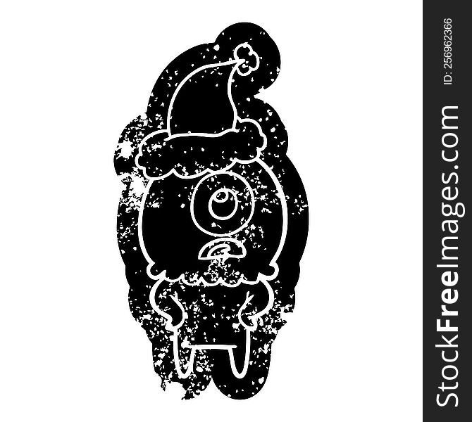 Cartoon Distressed Icon Of A Cyclops Alien Spaceman Wearing Santa Hat