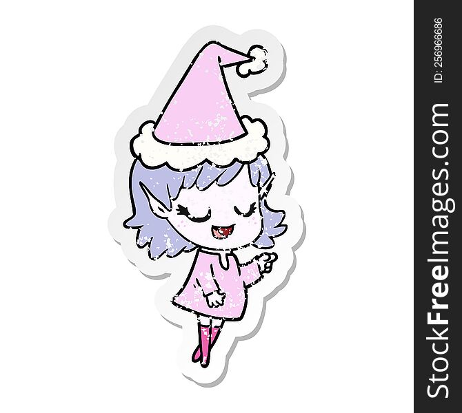 happy hand drawn distressed sticker cartoon of a elf girl pointing wearing santa hat