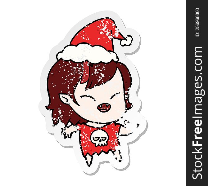 Distressed Sticker Cartoon Of A Laughing Vampire Girl Wearing Santa Hat