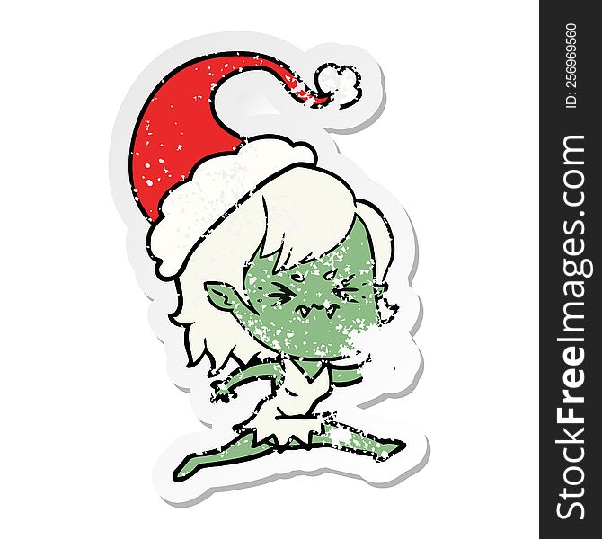 Annoyed Distressed Sticker Cartoon Of A Vampire Girl Wearing Santa Hat