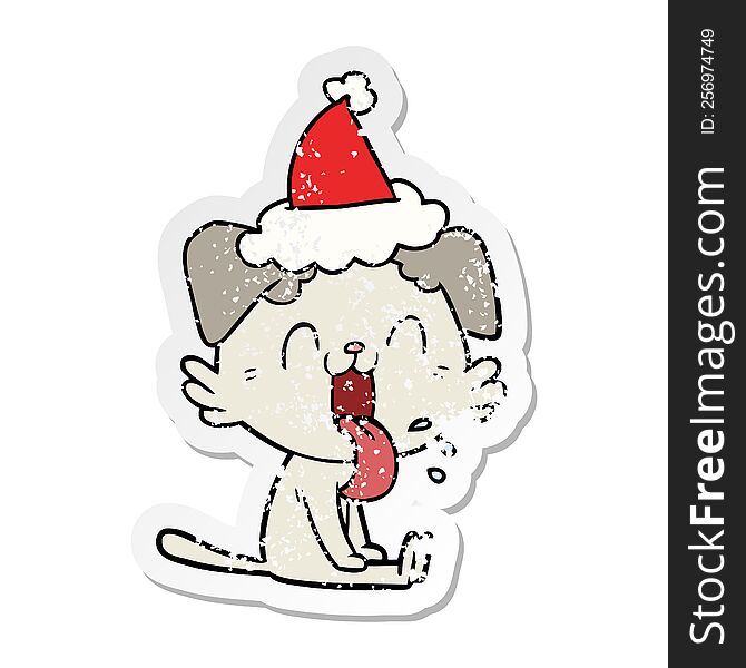 Distressed Sticker Cartoon Of A Panting Dog Wearing Santa Hat