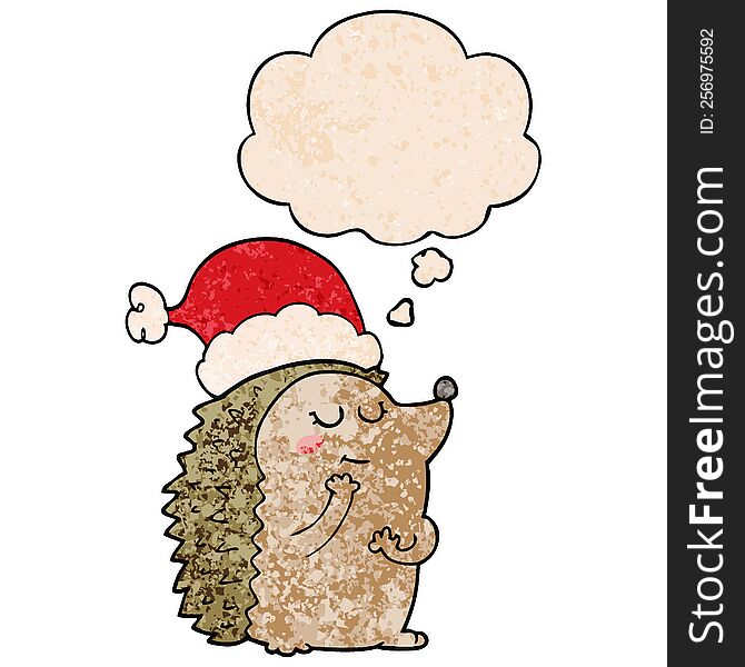cartoon hedgehog wearing christmas hat with thought bubble in grunge texture style. cartoon hedgehog wearing christmas hat with thought bubble in grunge texture style