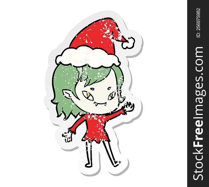 hand drawn distressed sticker cartoon of a friendly vampire girl wearing santa hat