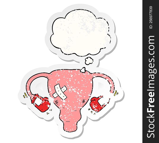 cartoon beat up uterus with boxing gloves and thought bubble as a distressed worn sticker