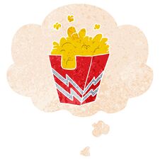 Cartoon Box Of Popcorn And Thought Bubble In Retro Textured Style Royalty Free Stock Photo