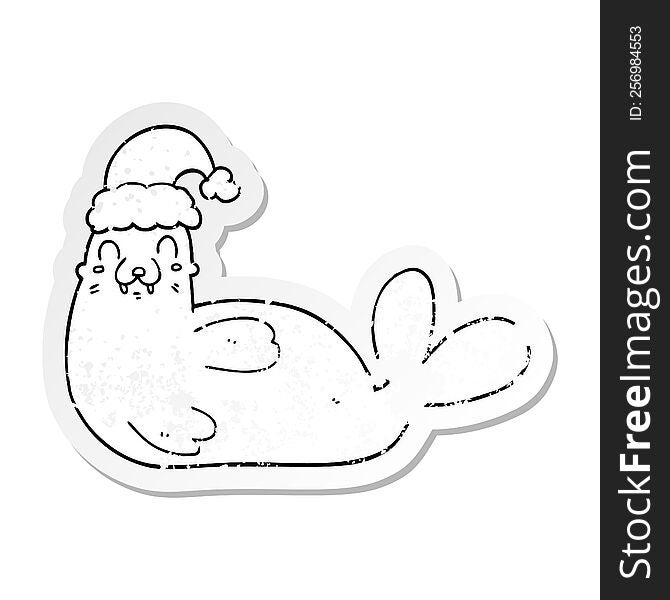 distressed sticker of a cartoon christmas walrus