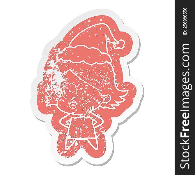 Cartoon Distressed Sticker Of A Girl Pouting Wearing Santa Hat