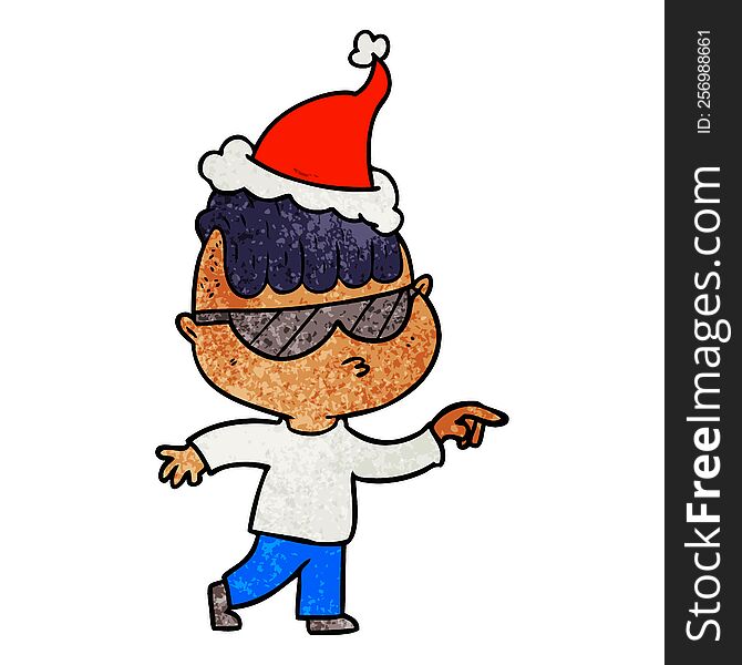hand drawn textured cartoon of a boy wearing sunglasses pointing wearing santa hat