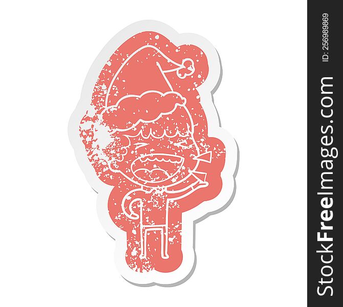 Cartoon Distressed Sticker Of A Laughing Man Wearing Santa Hat