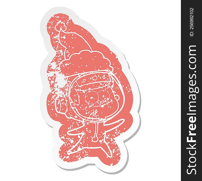 Happy Astronaut Cartoon Distressed Sticker Of A Wearing Santa Hat