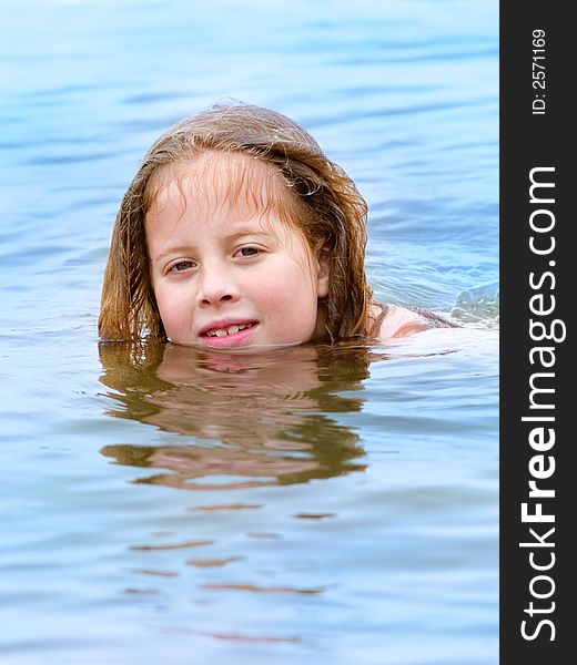 Little girl swiming in the sea