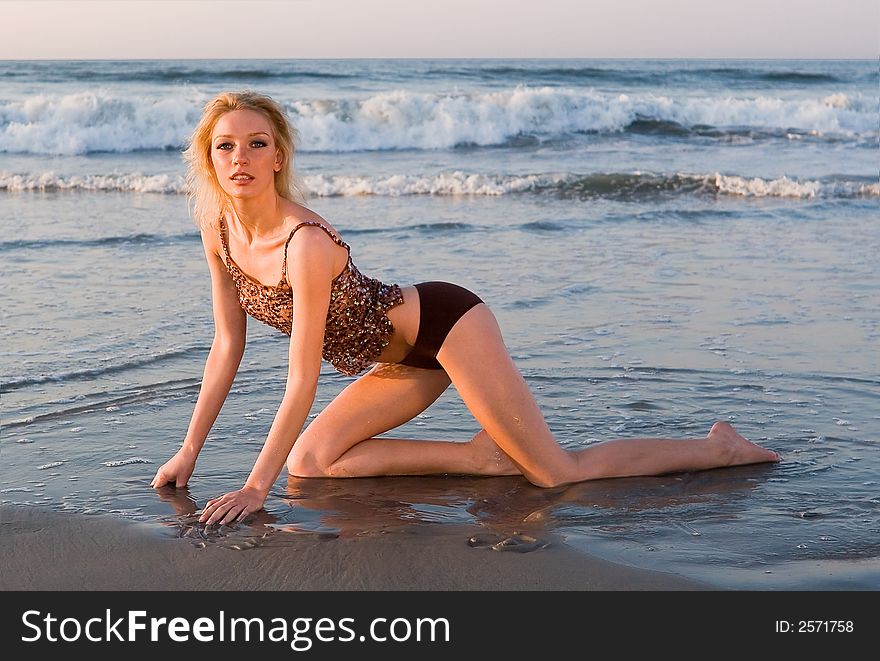 A girl on the beach in a bikini. A girl on the beach in a bikini