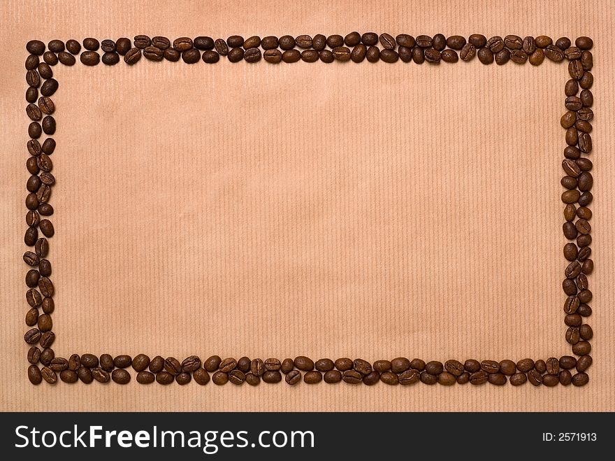 Rectangle frame made of two rows coffee beans on the brown, stripped paper. Rectangle frame made of two rows coffee beans on the brown, stripped paper.