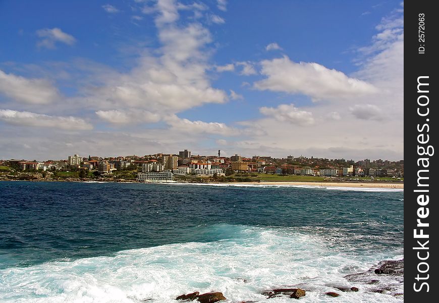 Overlooking the city and surf on a beautiful sunny summer day at Bondi Beach, Sydney, New South Wales (NSW), Australia. Overlooking the city and surf on a beautiful sunny summer day at Bondi Beach, Sydney, New South Wales (NSW), Australia