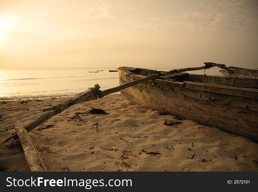 Hand built catamaran on the beach at sunrise Mombasa Kenya