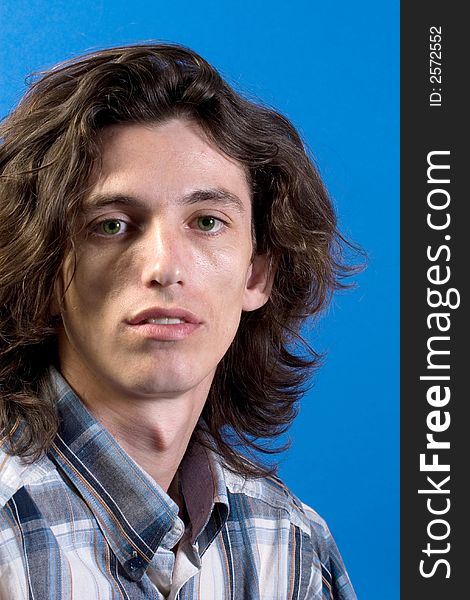 Simple portrait of young man with long hair. Simple portrait of young man with long hair