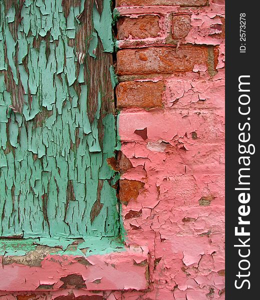 A close-up of the windowsill of an abandoned, pink building in downtown Toledo, OH.