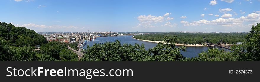 Panoramic sight of Kiev city bridge through river. Panoramic sight of Kiev city bridge through river