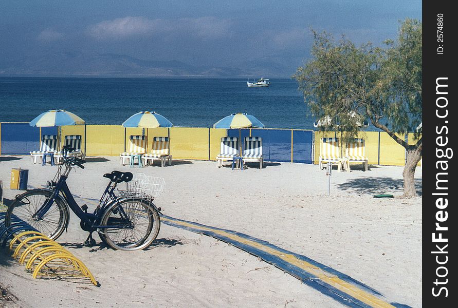 Bicycles parked on a sun drenched beach. Bicycles parked on a sun drenched beach