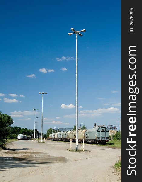 Goods van on station in sunny day