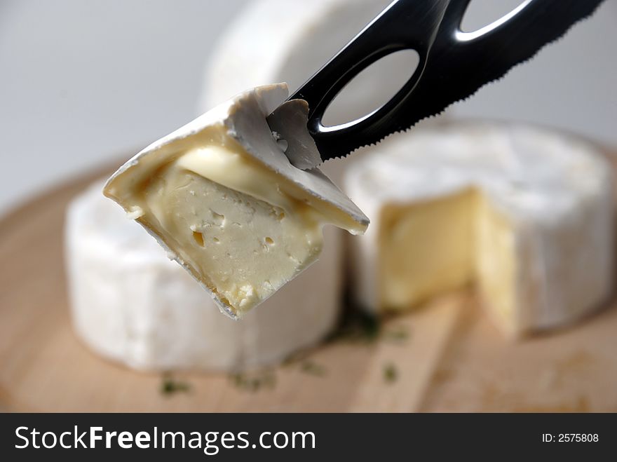 Arrangement with cheese and knife. Arrangement with cheese and knife