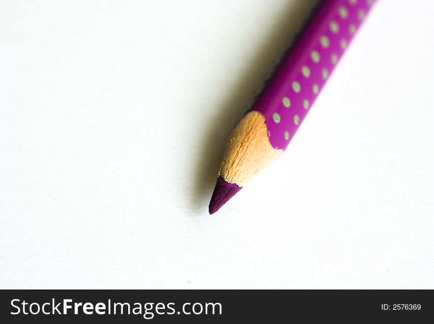 Purple pencil on white paper
