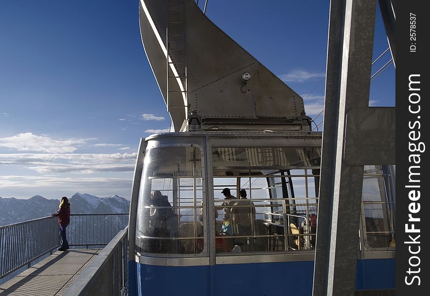 Large ski tram with passengers at top of lift. Large ski tram with passengers at top of lift