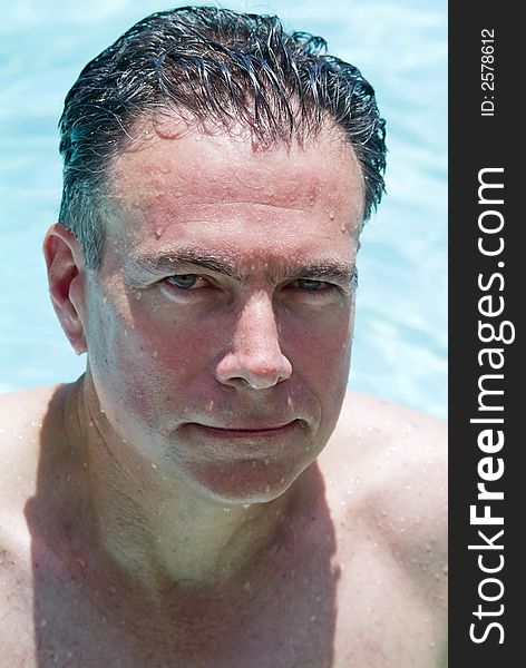 Portrait of a man in a swimming pool. Portrait of a man in a swimming pool.
